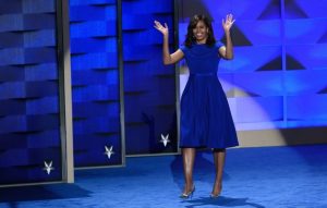 US First Lady Michelle Obama gestures during Day 1 of the Democratic National Convention at the Wells Fargo Center in Philadelphia, Pennsylvania, July 25, 2016. / AFP / SAUL LOEB (Photo credit should read SAUL LOEB/AFP/Getty Images)
