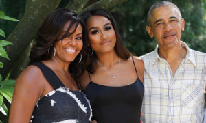Sasha Obama with parents Michelle and Barack Obama