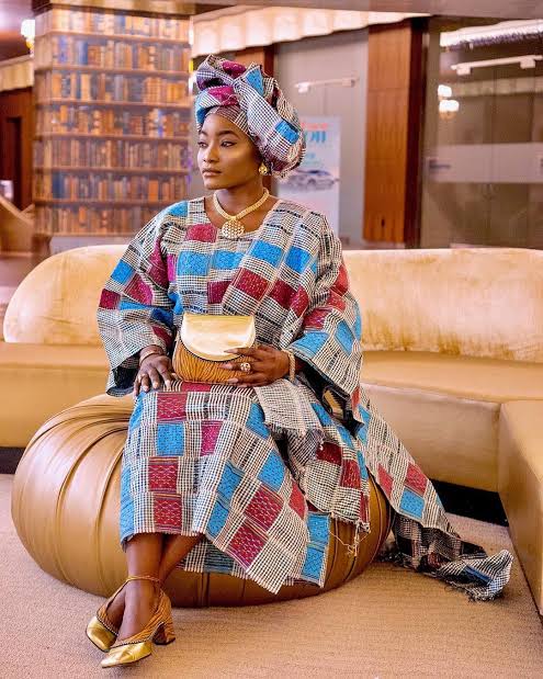 A Nigerian woman wearing Aso-oke